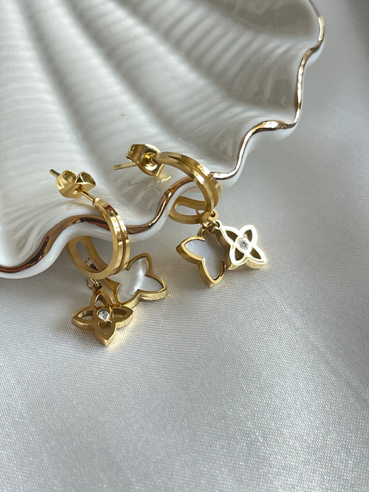 Dangling charm earrings