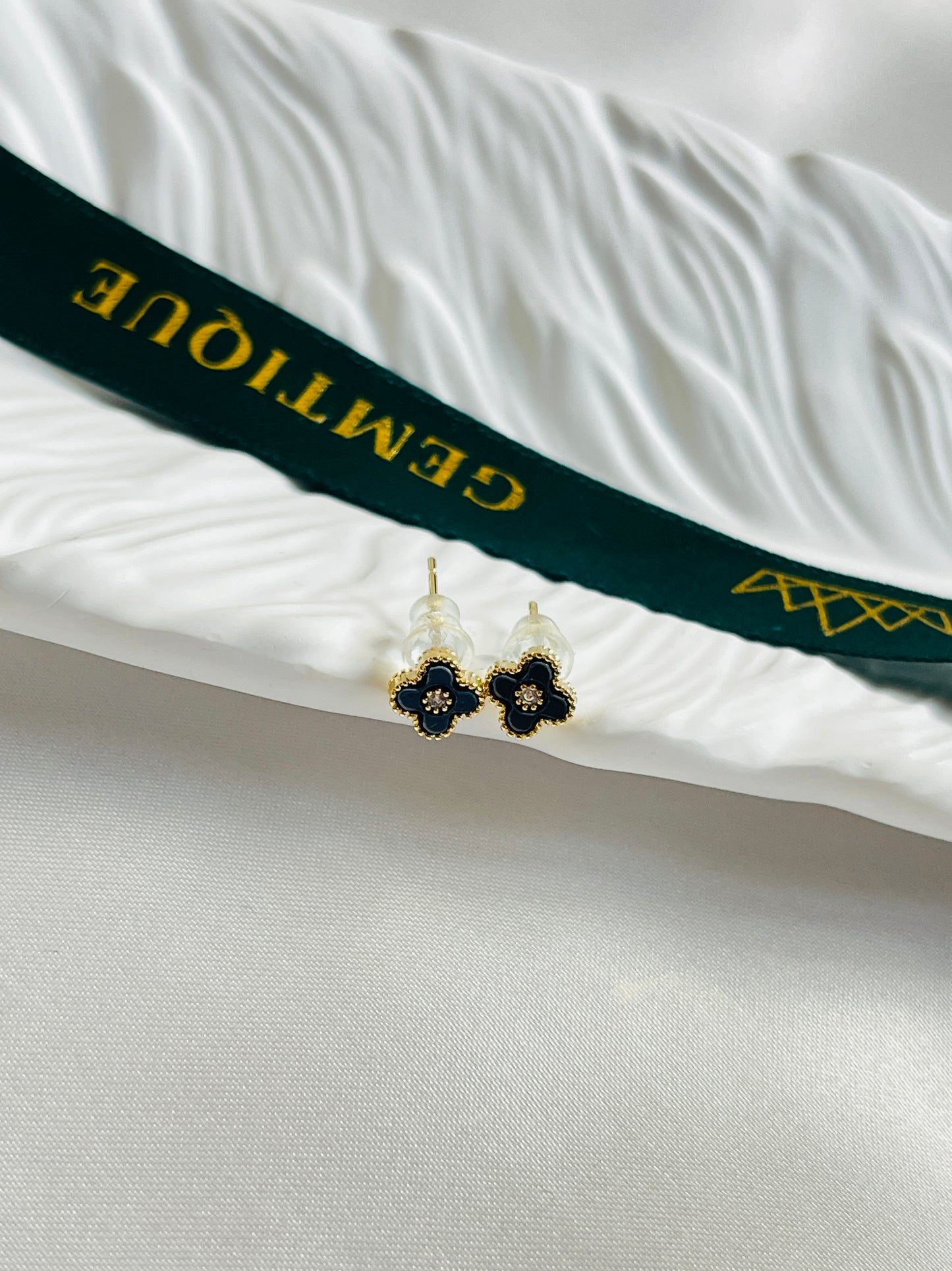 Black mini clover studs